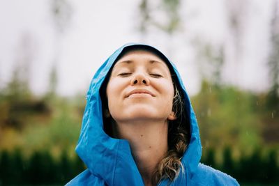 Portrait of beautiful young woman with eyes closed