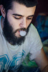 Close-up of man smoking hookah