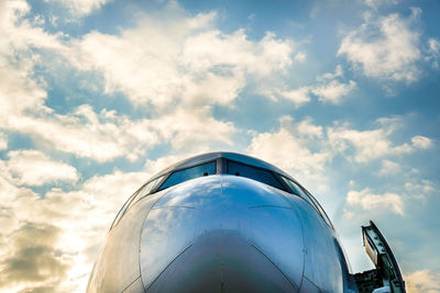 Low angle view of airplane against sky