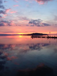 Scenic view of sea against orange sky