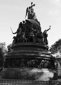 Low angle view of statue fountain against sky