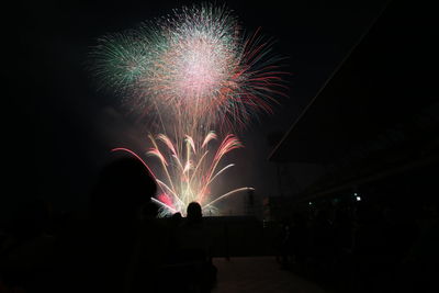 Firework display at night