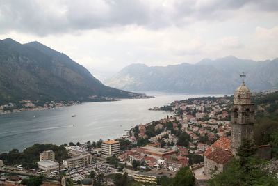 High angle view of buildings against cloudy sky