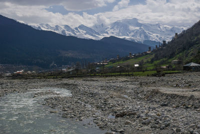 Scenic view of landscape and mountains against sky