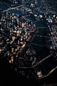 High angle view of city lit up at night