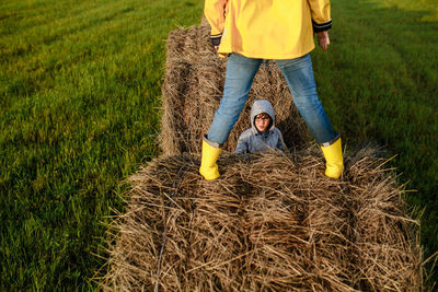 Rear view of man and woman on field