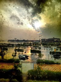 Scenic view of lake against sky in city