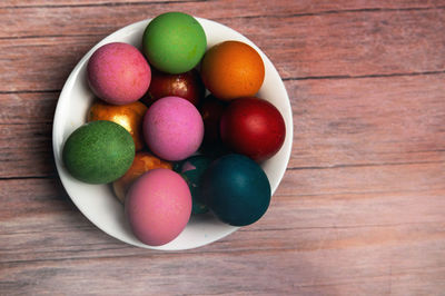 High angle view of multi colored easter eggs on table