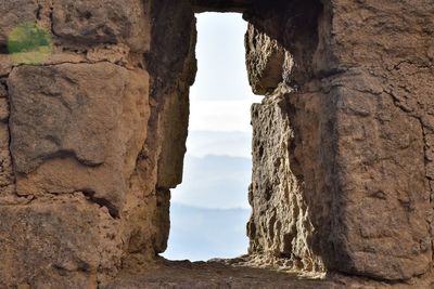 View of the valley through a castle defensive wall