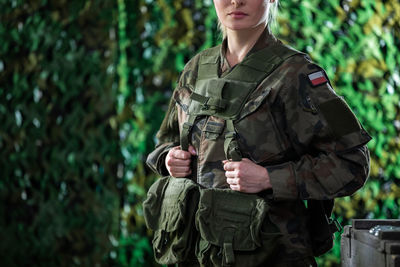 Sample uniforms and equipment of a soldier in the polish army. woman in polish army.