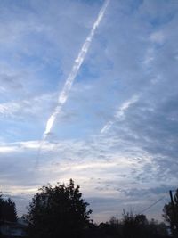Low angle view of vapor trails in sky