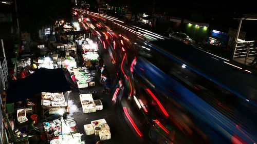 High angle view of light trails on road at night