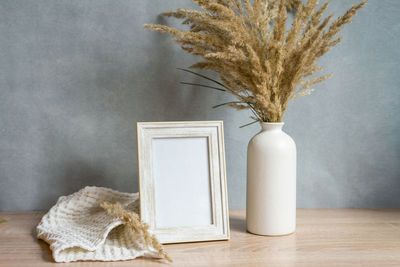 Portrait frame mock up with dried flowers