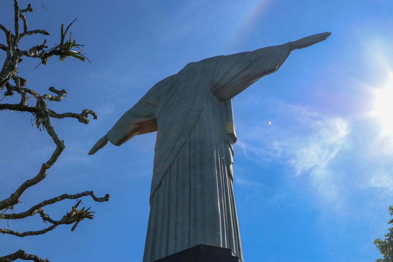 LOW ANGLE VIEW OF STATUE AGAINST BLUE SKY AND CLOUDS