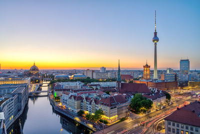 Downtown berlin after sunset with the tv tower, the river spree and the cathedral