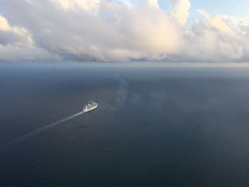 Scenic view of sea against cloudy sky