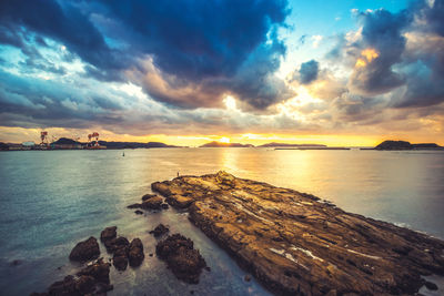 Scenic view of sea against sky at sunset