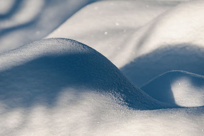 Snow that has been shaped by wind into beautiful hills