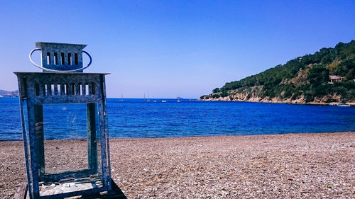 Scenic view of sea against clear blue sky