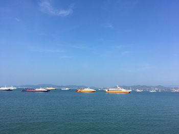 Scenic view of sea against blue sky