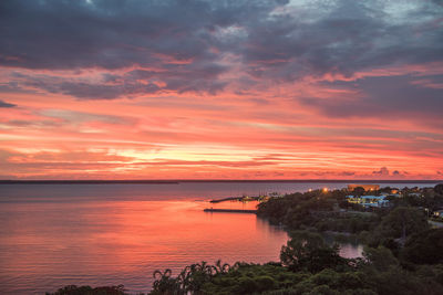 Scenic view of sea against orange sky