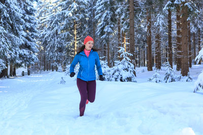 Full length of child on snow covered land