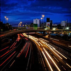 High angle view of light trails on road at night