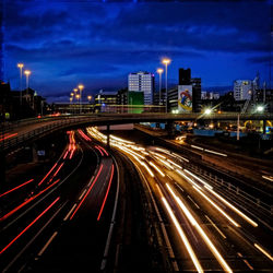 High angle view of light trails on road at night