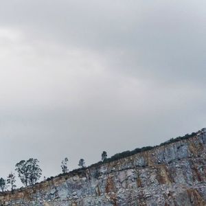 Low angle view of rocks against sky