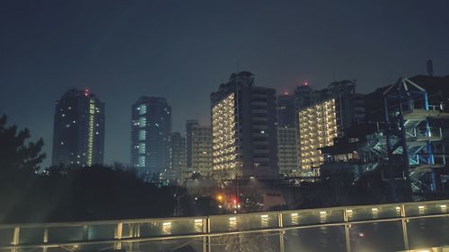 Illuminated buildings in city at night