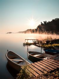 Scenic view of lake against sky during sunset