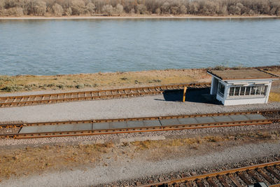 Rail scales for static and coupled in motion weighing with station house next to river