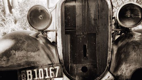 Close-up of car on road