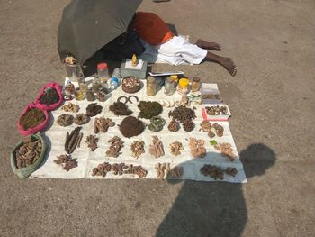 High angle view of man selling spices