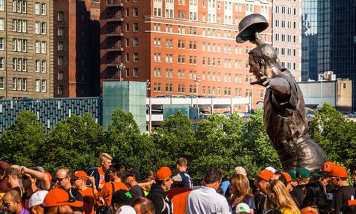 Group of people in front of buildings