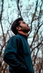 Side view of young man looking away