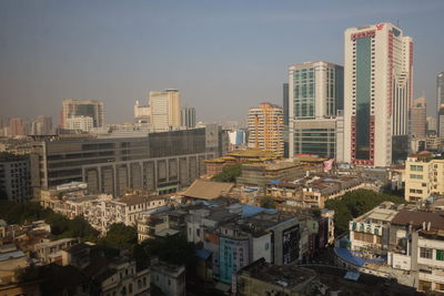 High angle view of buildings in city against sky