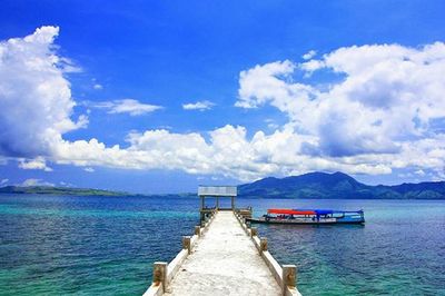 Scenic view of sea against cloudy sky