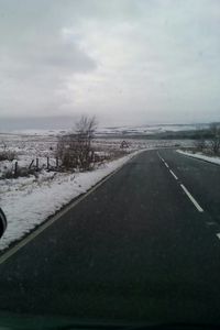 Road against cloudy sky