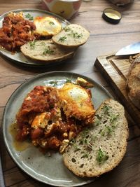 High angle view of food in plate on table shakshuka