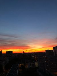 High angle view of buildings against sky during sunset