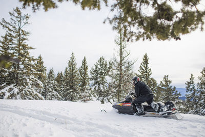 Retired man enjoys snowmobiling during leisure time