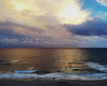 Scenic view of sea against sky at sunset