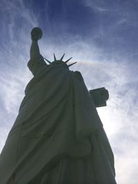 Low angle view of statue against cloudy sky