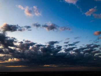 Low angle view of dramatic sky during sunset