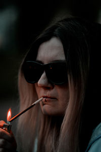 Close-up portrait of young woman with eyes closed