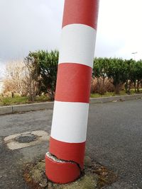 Close-up of red umbrella on road