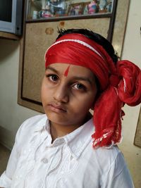 Portrait of boy in traditional clothing at home