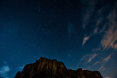 Low angle view of mountain against sky at night