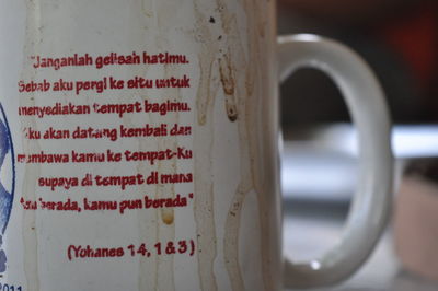 Close-up of text on coffee cup